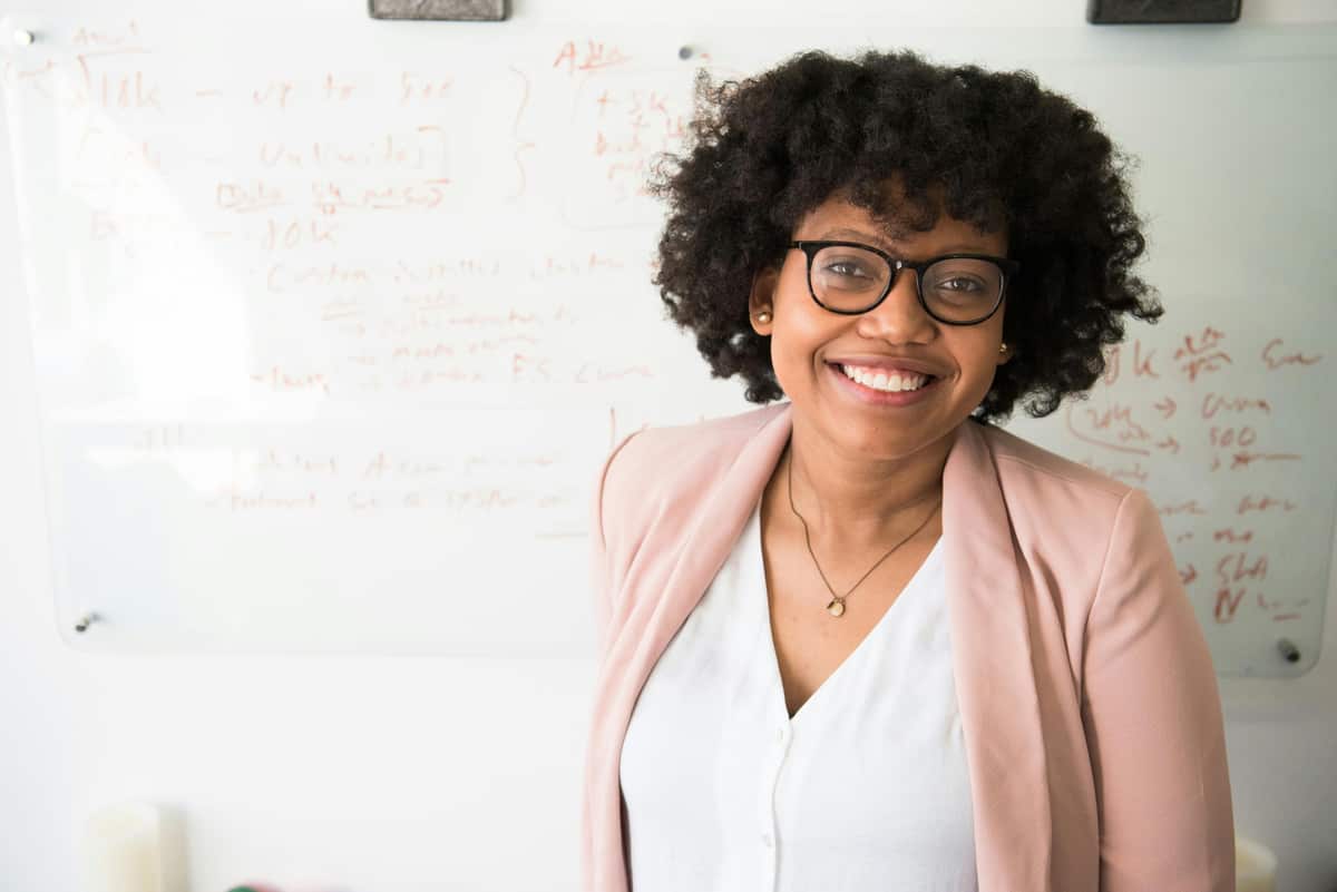 A smiling digital strategist in a bright office