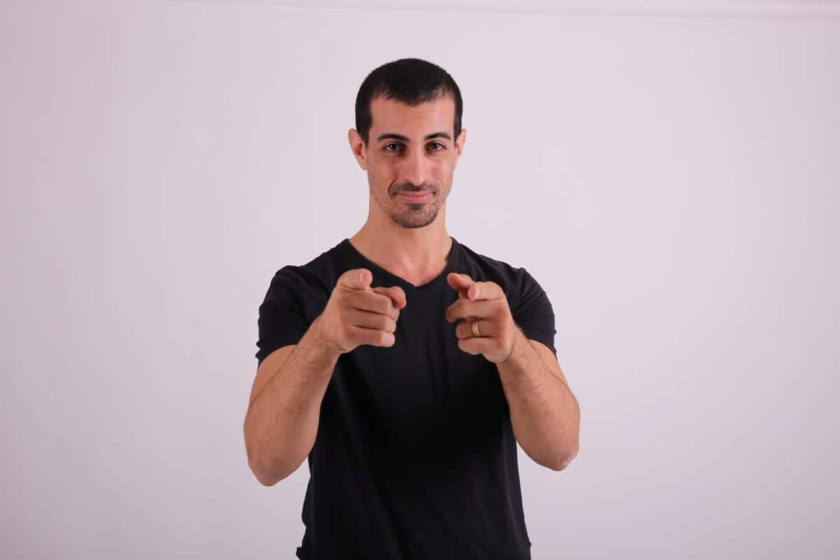 A ministry IT leader pointing toward the camera