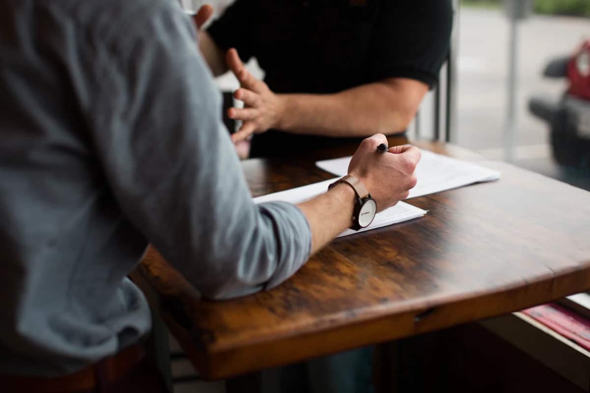 Two people working together at a desk
